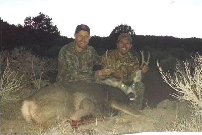 Me and my buddy Lance with the buck