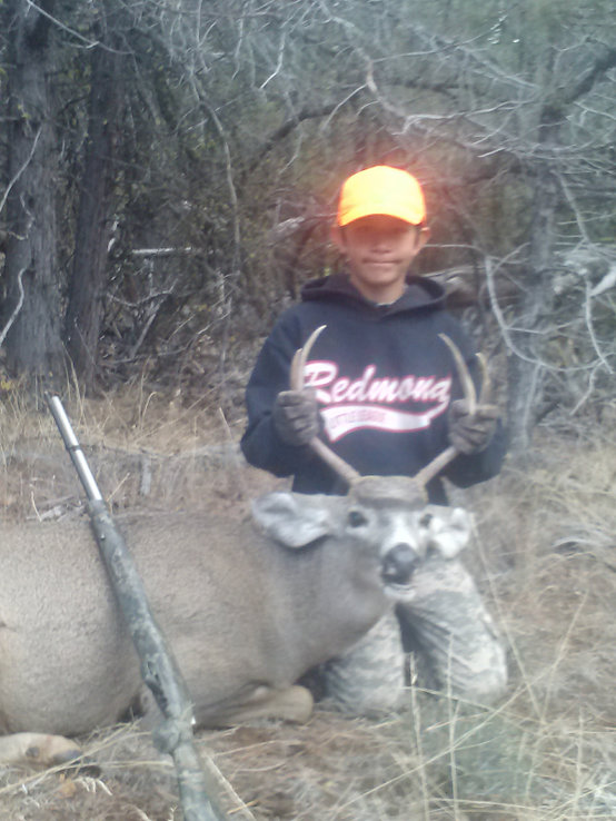 This year he killed this nice little forked  horn with a muzzle loader.  Open sites,  80b yards,  free hand.  Shot his heart  out!  I am very proud of him ! I can't believe his so called father won't make time to even see him once a year.