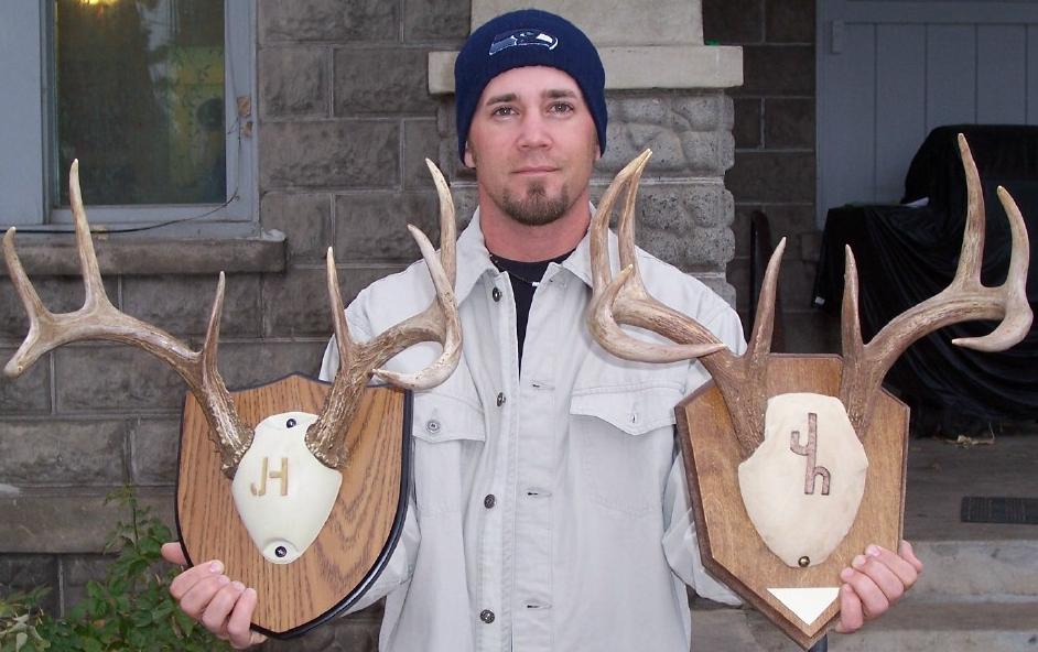 My brother with the racks from the two whitetail we took in Idaho last year (Mine is on the right)