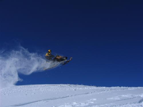 Snowmobiling (catching some air)